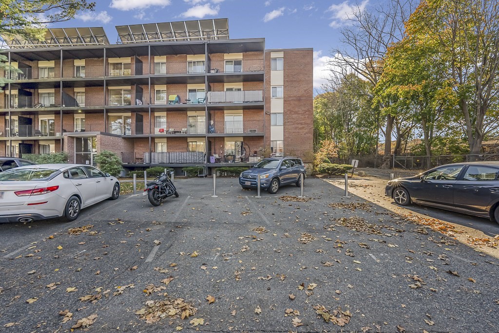 45 Oval Road, Unit 12 Quincy, MA 02170 - Photo 10 of 12 a car parked in front of a building
