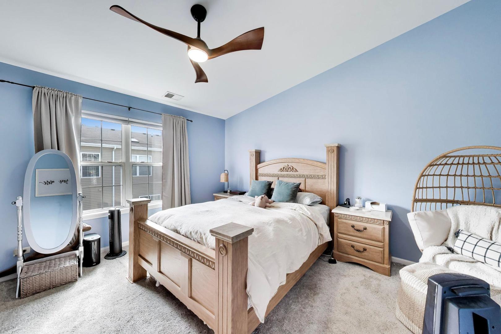 590 Triumph Court Hainesville, IL 60073 - Photo 18 of 25 a bedroom with a bed a couch and dresser