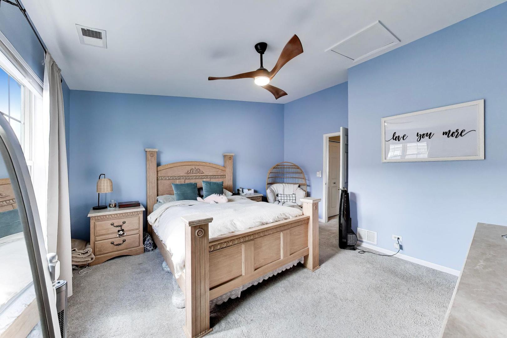 590 Triumph Court Hainesville, IL 60073 - Photo 20 of 25 a bed room with a bed and a window