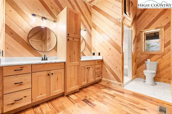 a bathroom with a sink a vanity and a mirror