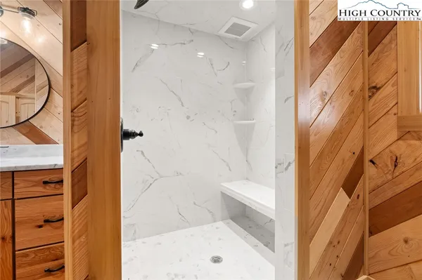a bathroom with a bathtub and a shower