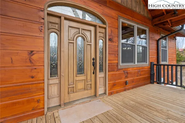 a view of a wooden door of the house