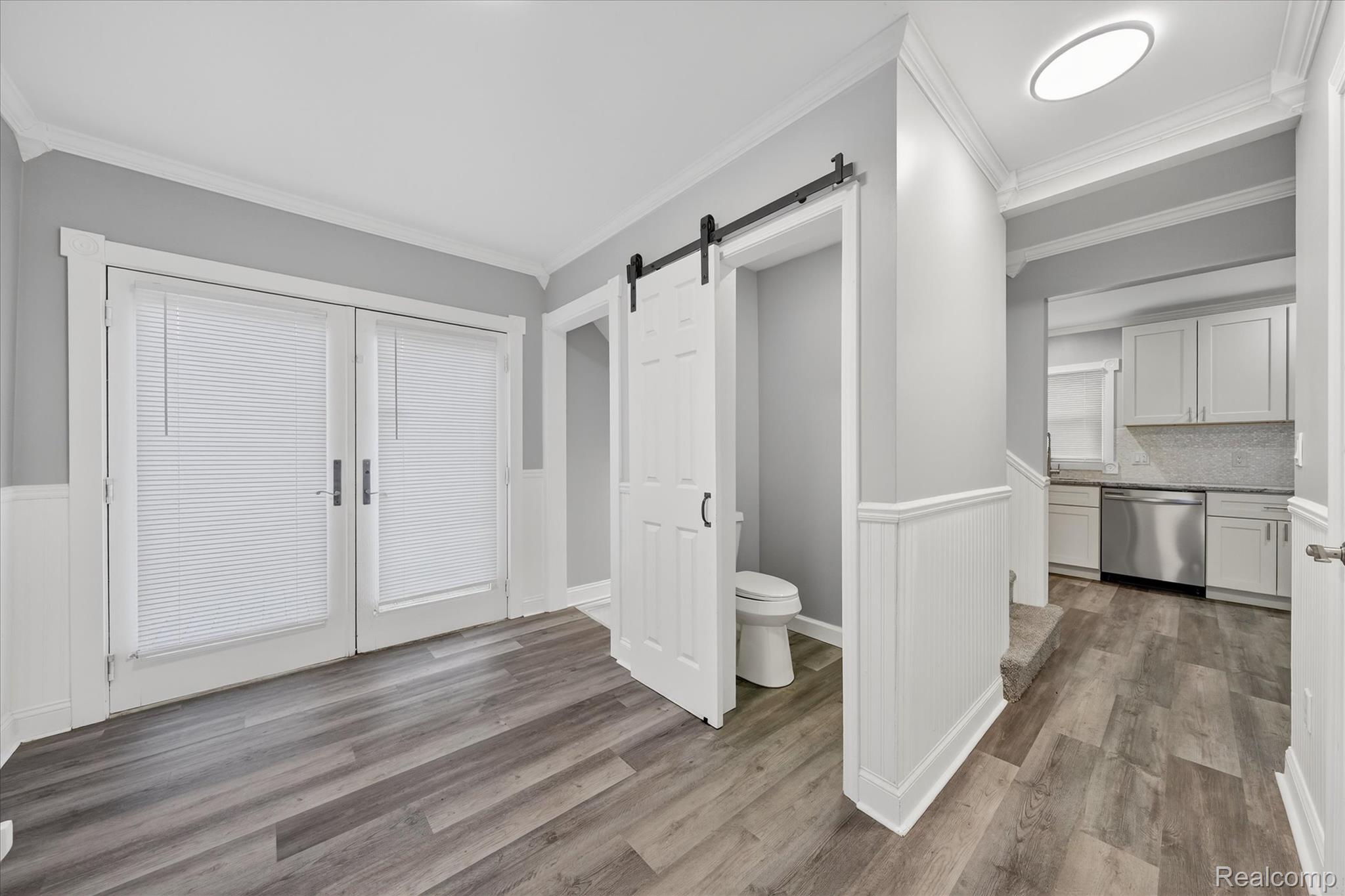 44003 Tyler Road Belleville, MI 48111 - Photo 16 of 29 Mud Room with Half bath by French Doors that lead to Deck