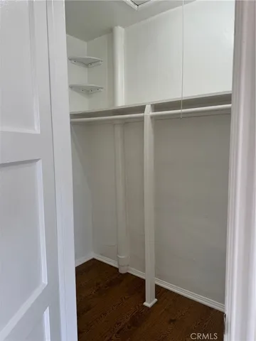 a view of an empty walk in closet