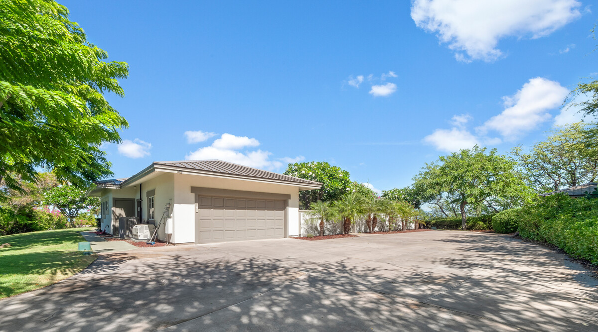59-380 Olomana Road Kamuela, HI 96743 - Photo 2 of 2 a front view of a house with a yard and garage