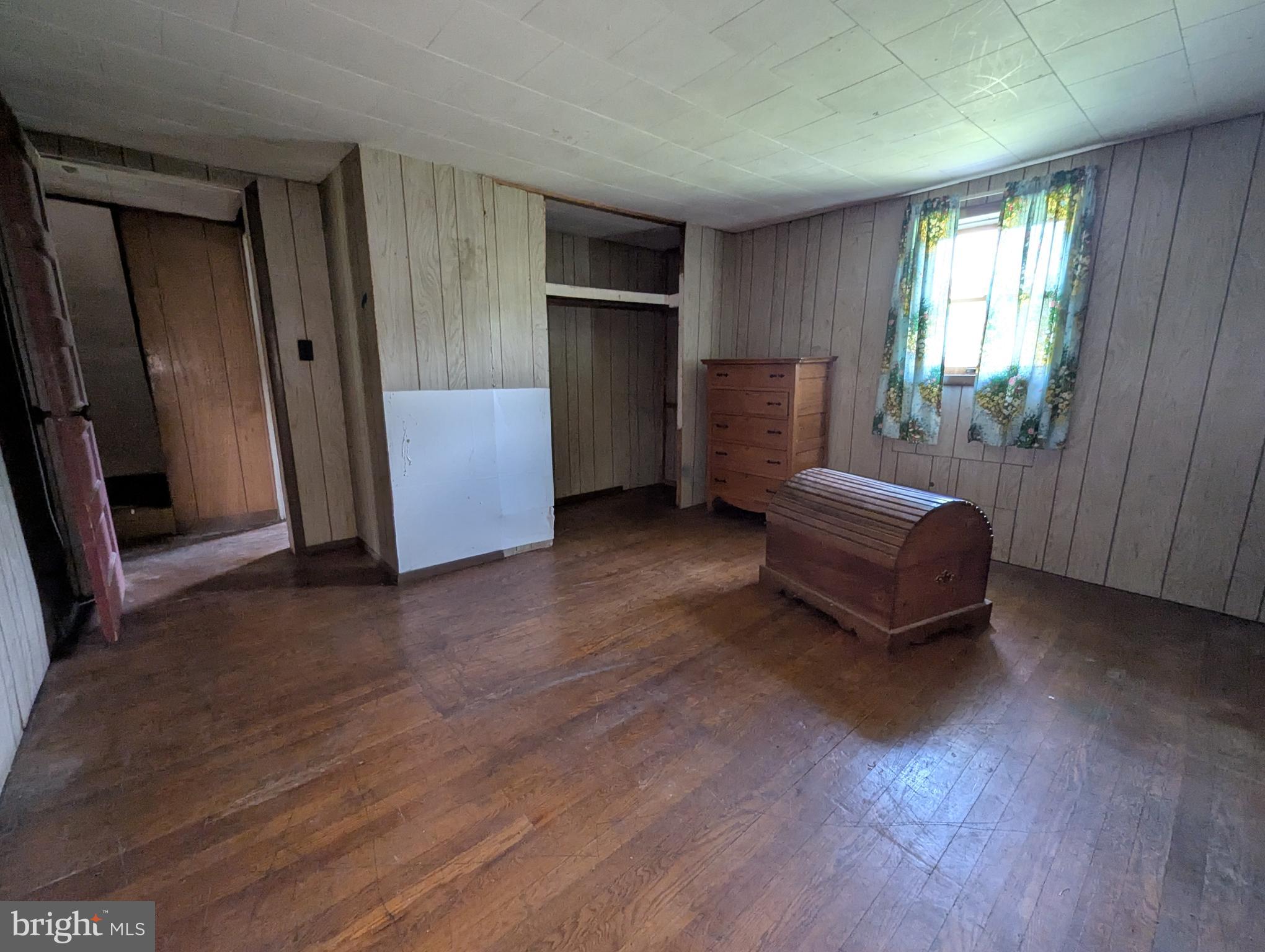 24001 Perry Hill Road Barton, MD 21521 - Photo 30 of 37 a living room with furniture and a window