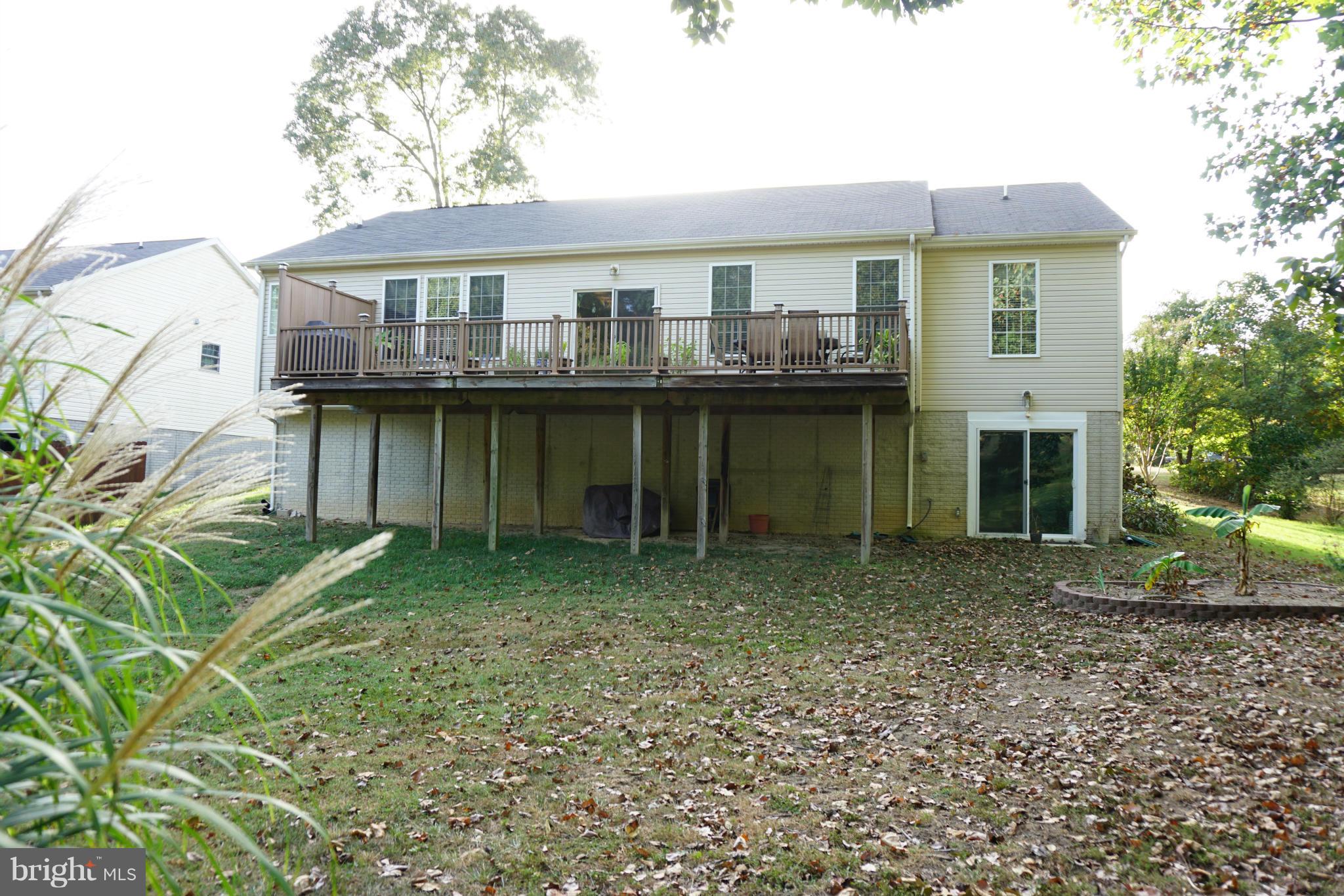 11202 Rawhide Road Lusby, MD 20657 - Photo 21 of 24 a view of a house with a outdoor space