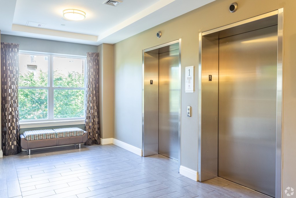 30 Mill Street, Unit 206 Arlington, MA 02476 - Photo 13 of 23 a view of empty room with wooden floor and fan