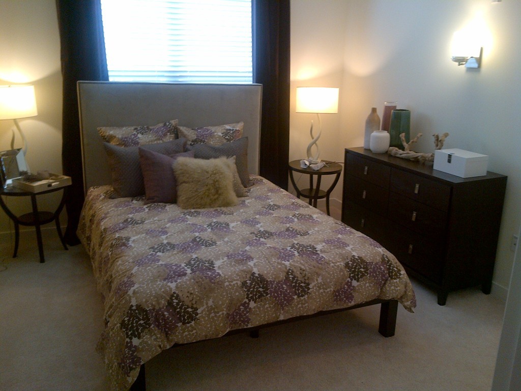 30 Mill Street, Unit 206 Arlington, MA 02476 - Photo 20 of 23 a bed sitting in a bedroom next to a window