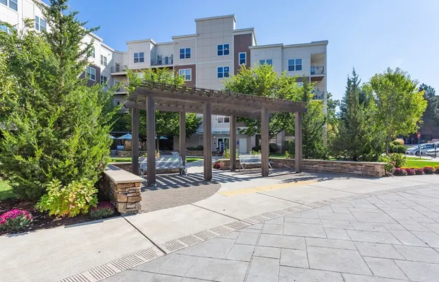 a view of a building with sitting area