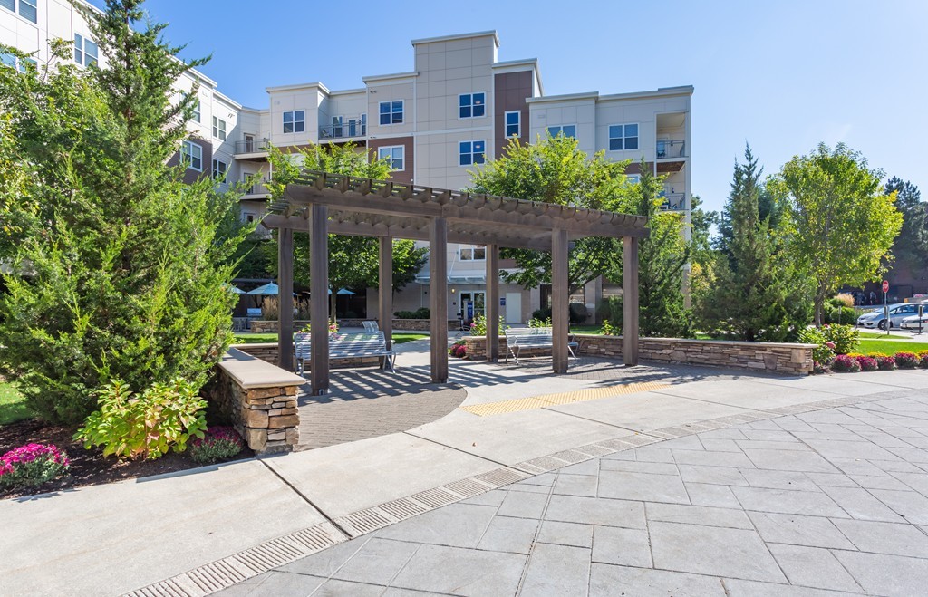 30 Mill Street, Unit 206 Arlington, MA 02476 - Photo 2 of 23 a view of a building with sitting area