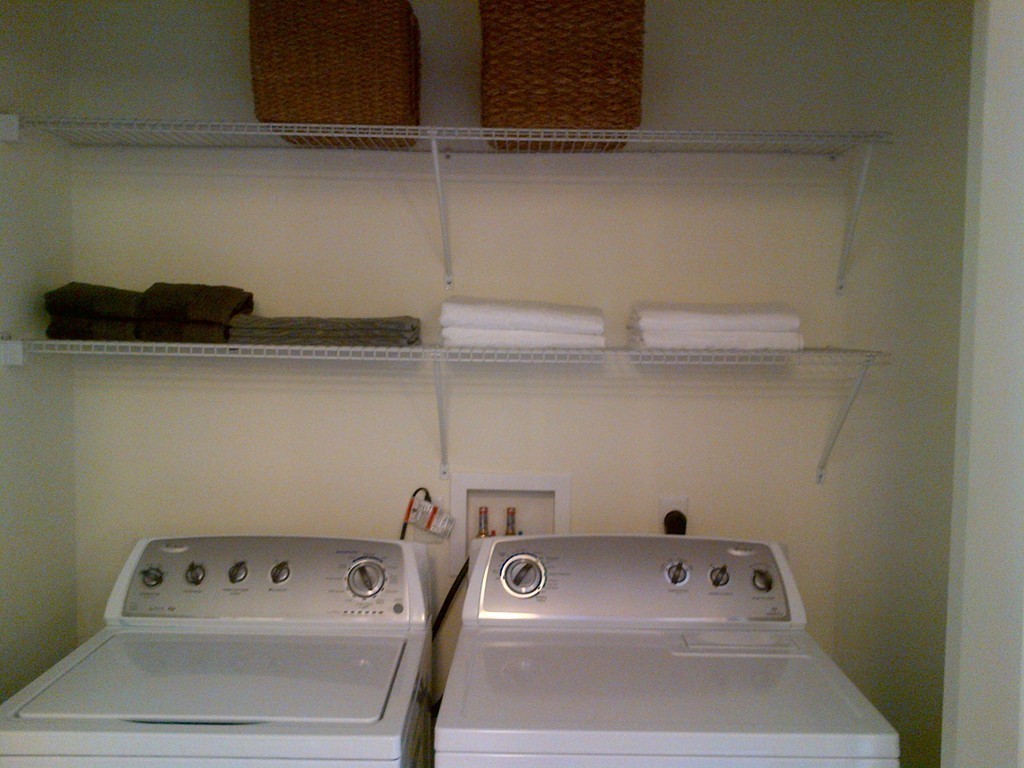 30 Mill Street, Unit 206 Arlington, MA 02476 - Photo 21 of 23 a utility room with dryer and washer