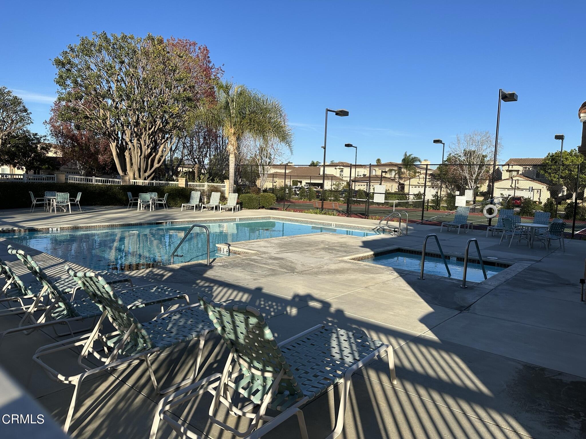 2190 Eastridge Loop Oxnard, CA 93036 - Photo 19 of 21 a view of a swimming pool with outdoor seating