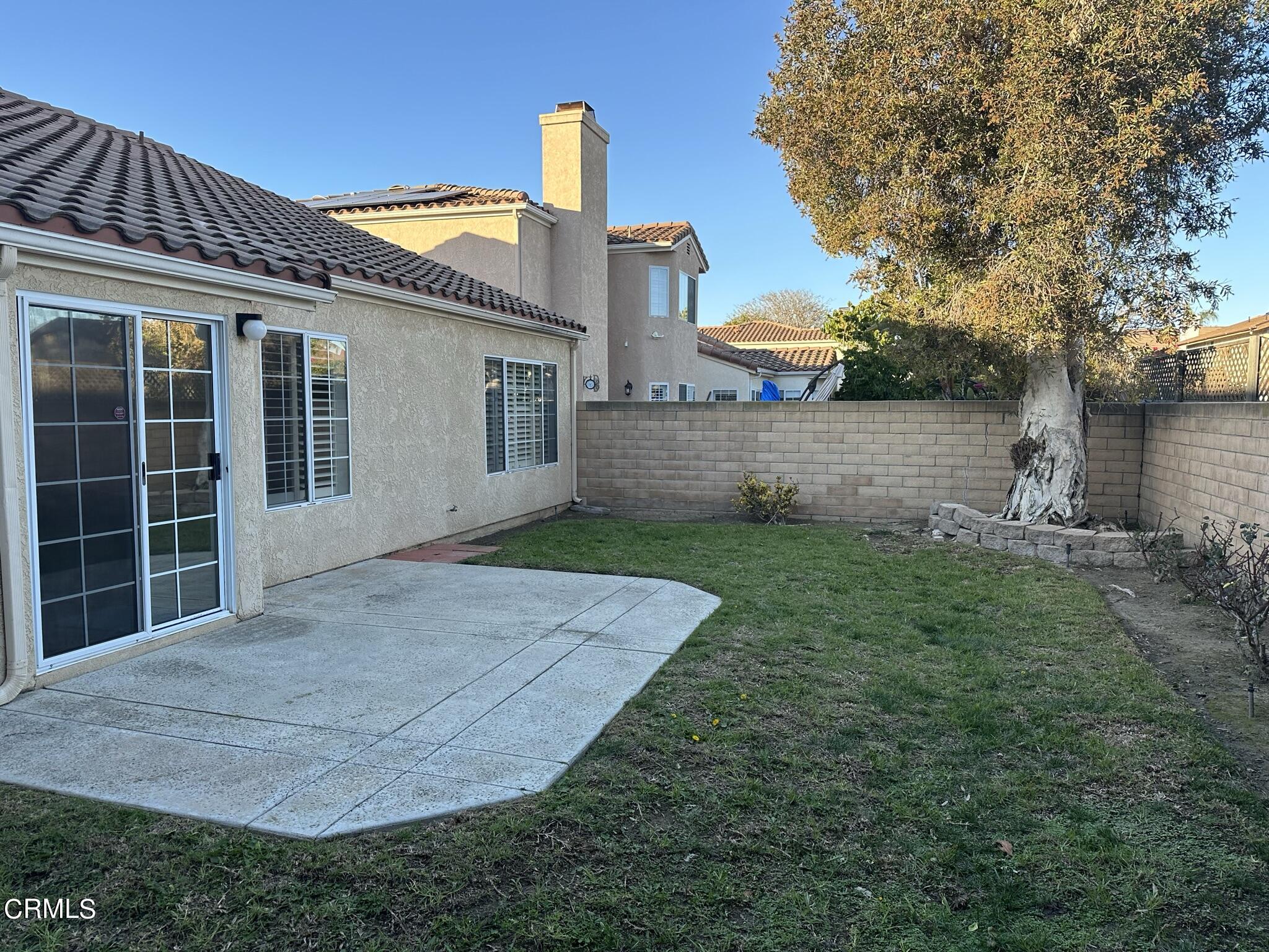 2190 Eastridge Loop Oxnard, CA 93036 - Photo 2 of 21 a front view of a house with garden