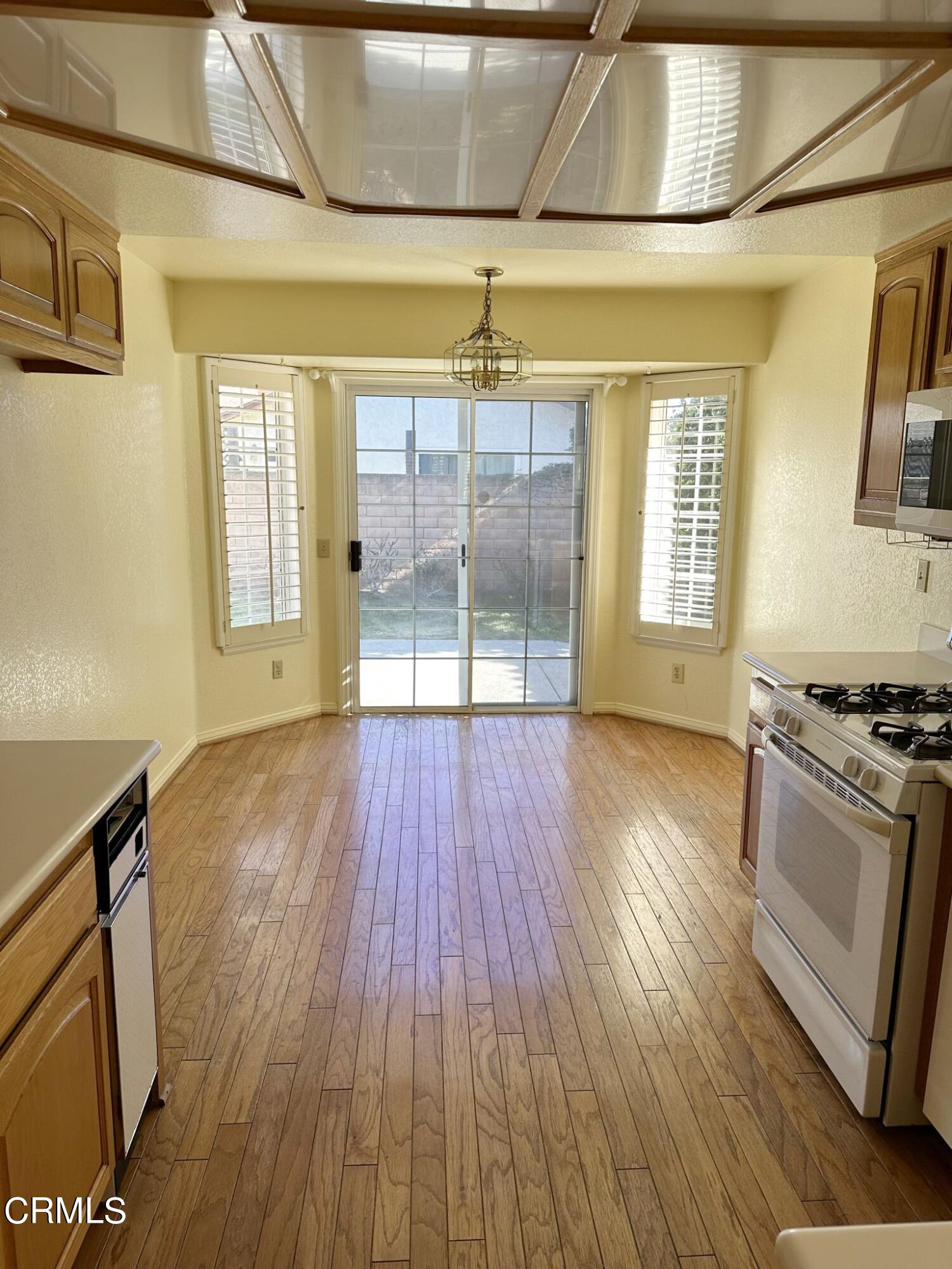 2190 Eastridge Loop Oxnard, CA 93036 - Photo 7 of 21 a view of a room with wooden floor and windows