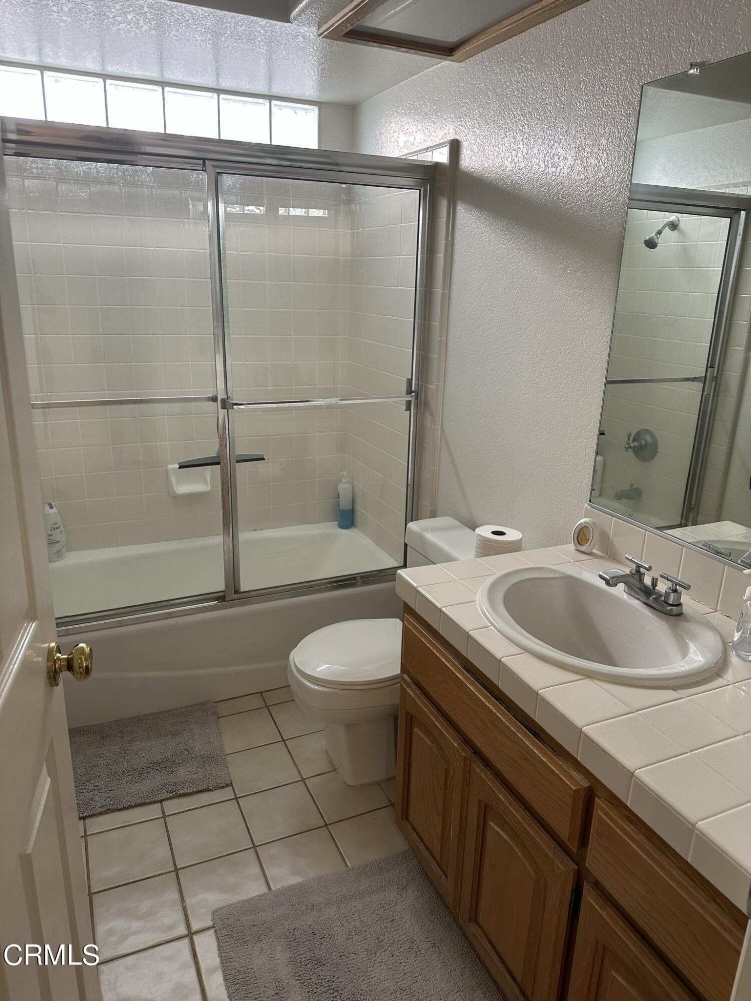 2190 Eastridge Loop Oxnard, CA 93036 - Photo 10 of 21 a bathroom with a sink toilet and shower