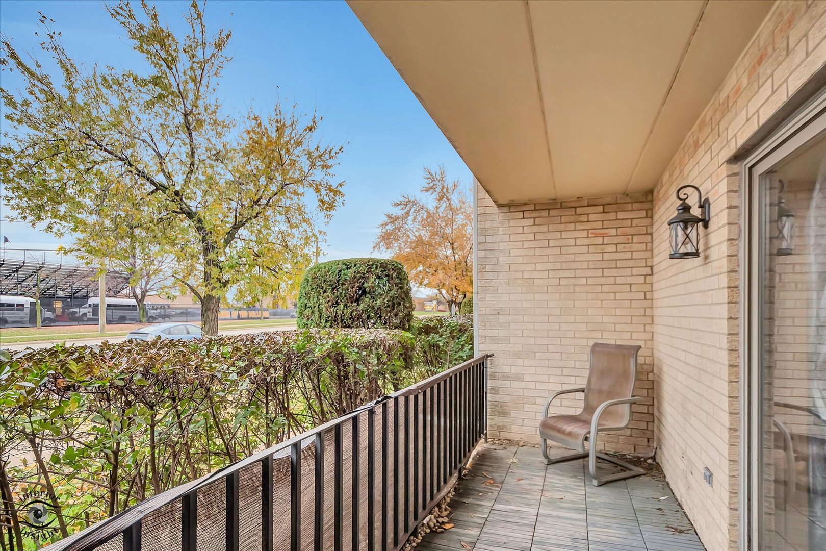 10538 Central Avenue, Unit 1S Chicago Ridge, IL 60415 - Photo 20 of 25 a view of a balcony with wooden floor and fence