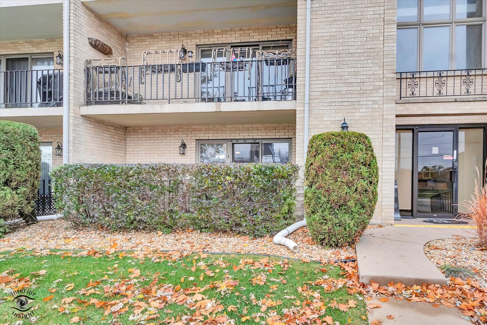 10538 Central Avenue, Unit 1S Chicago Ridge, IL 60415 - Photo 24 of 25 a view of a house with a small yard and plants