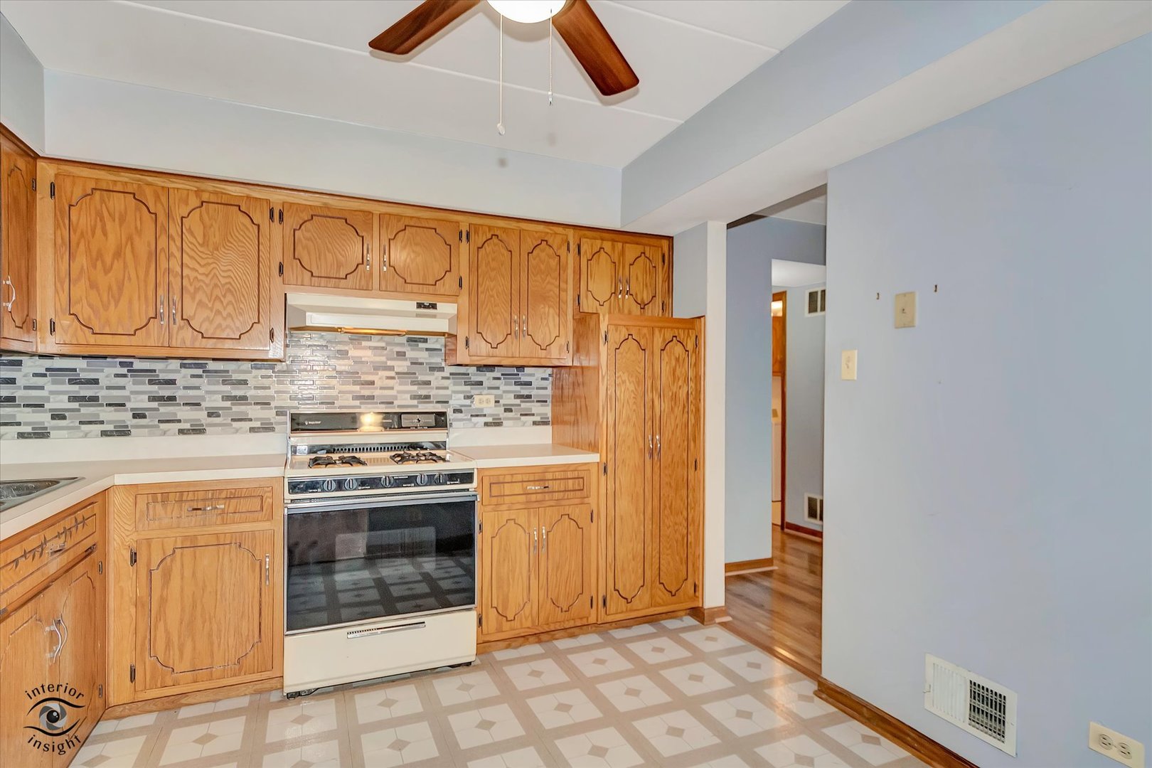 10538 Central Avenue, Unit 1S Chicago Ridge, IL 60415 - Photo 8 of 25 a kitchen with stainless steel appliances granite countertop a refrigerator and a stove