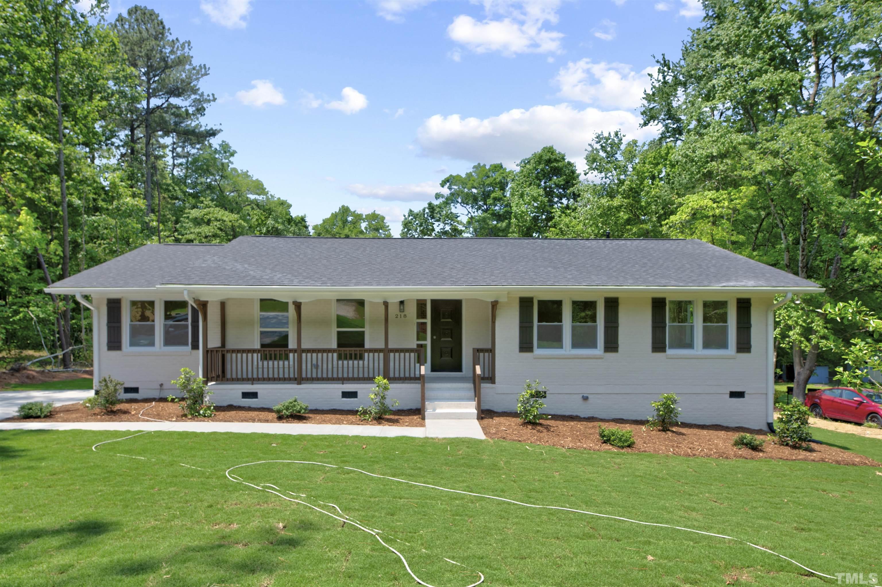218 Hocutt Road Durham, NC 27703 - Photo 1 of 43 a front view of house with yard and outdoor seating