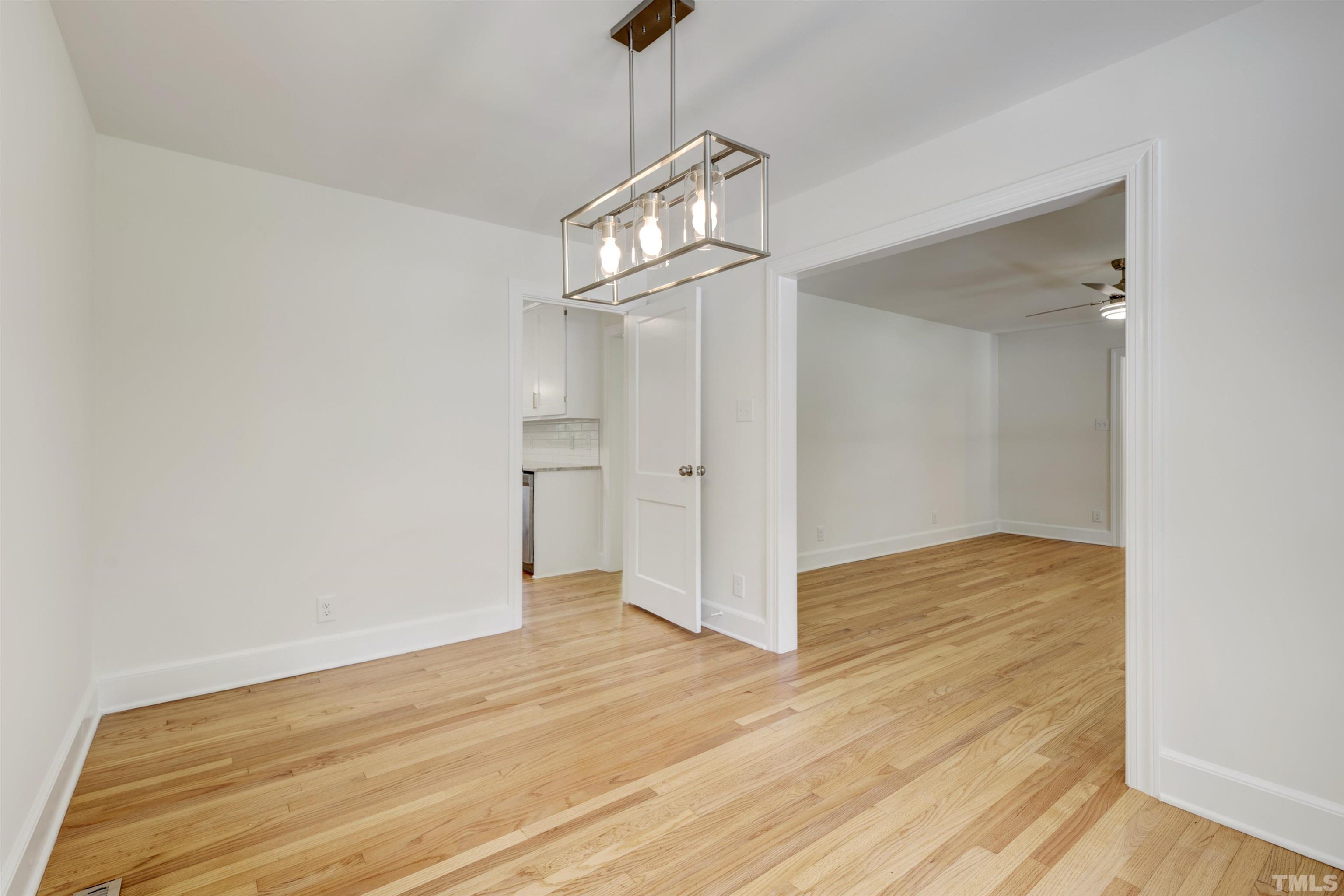 218 Hocutt Road Durham, NC 27703 - Photo 14 of 43 a view of empty room with wooden floor