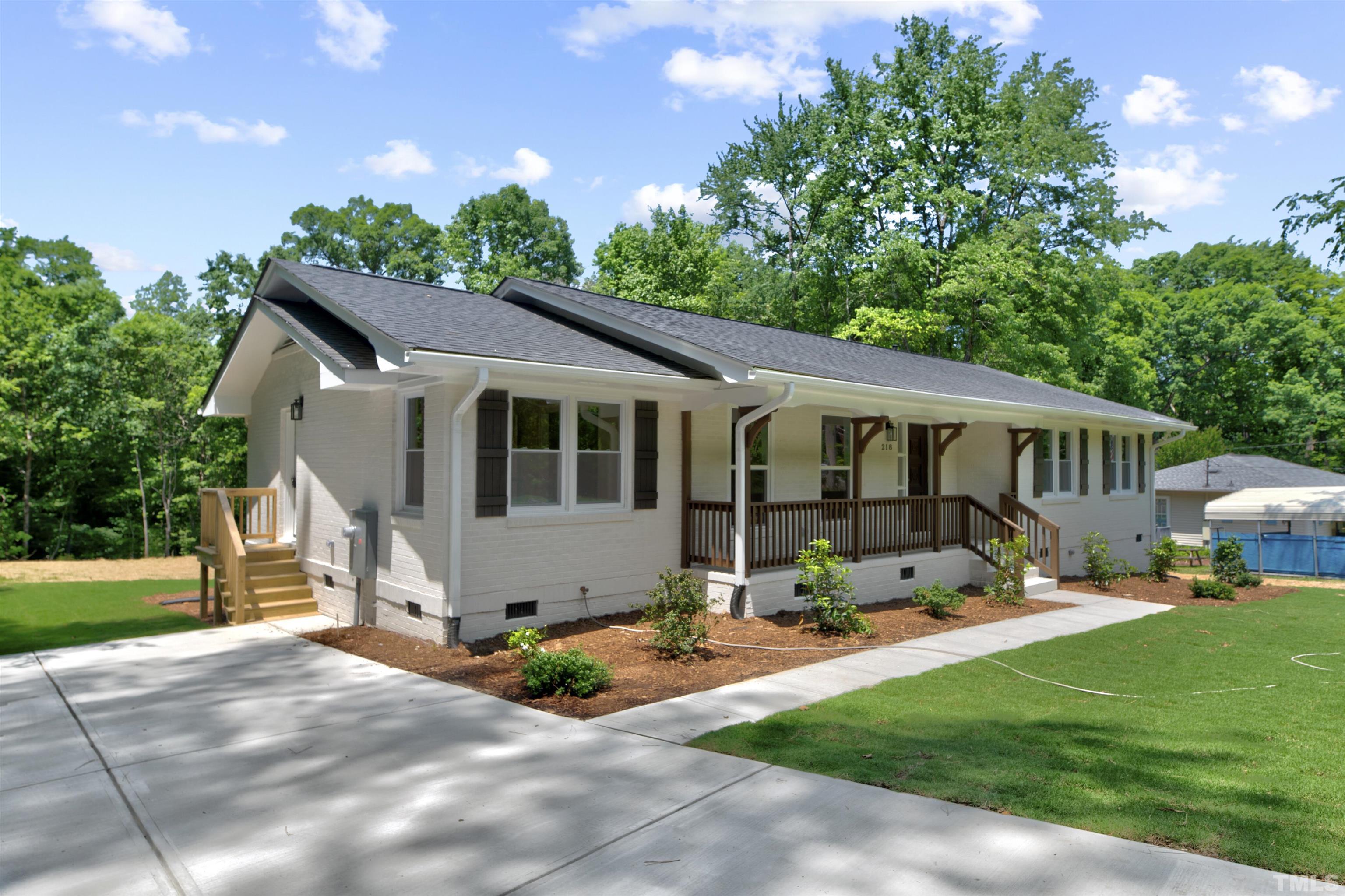218 Hocutt Road Durham, NC 27703 - Photo 2 of 43 a front view of a house with garden