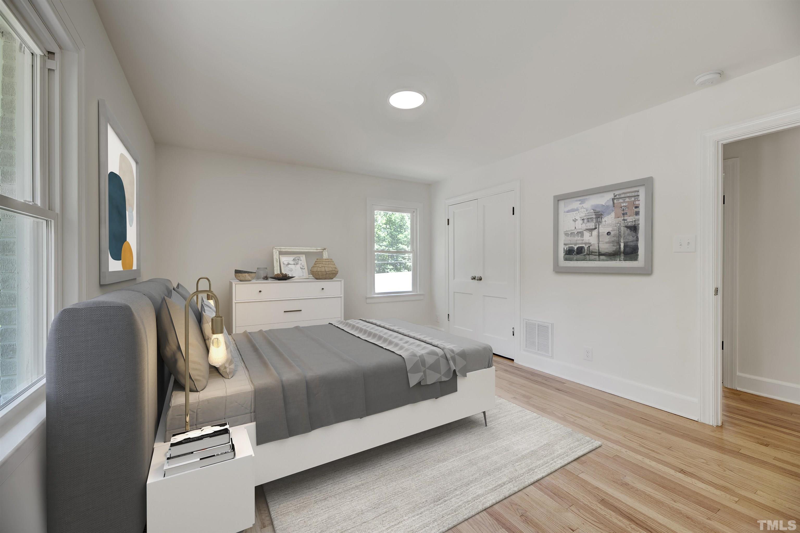218 Hocutt Road Durham, NC 27703 - Photo 31 of 43 a bedroom with a bed and wooden floor