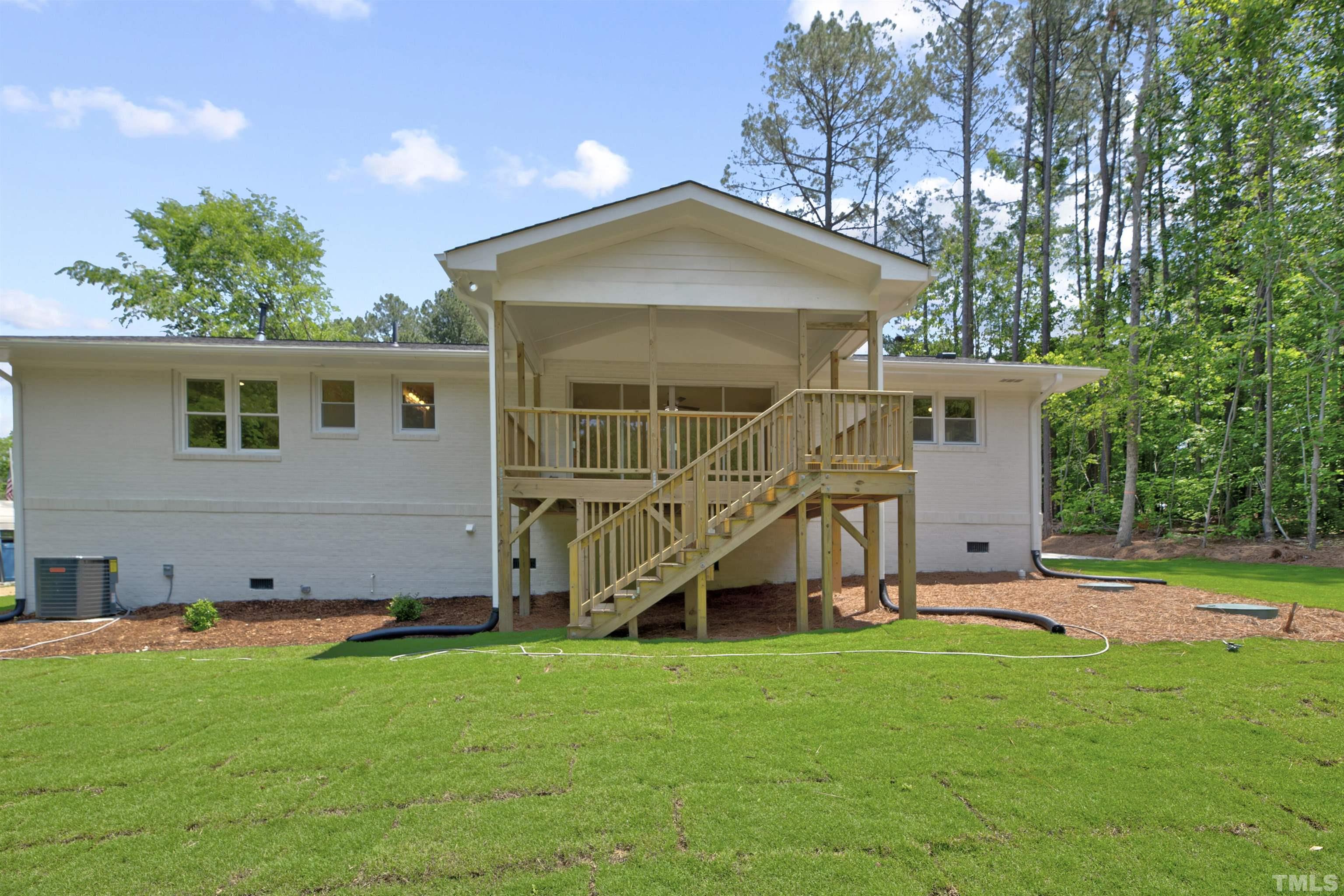218 Hocutt Road Durham, NC 27703 - Photo 39 of 43 a view of a house with a yard and sitting area