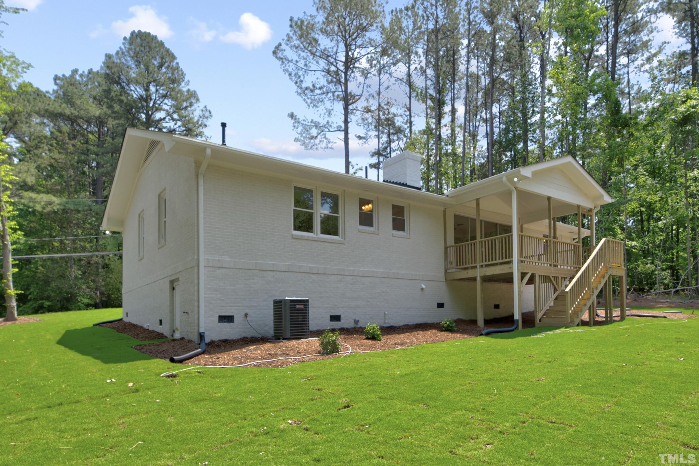 218 Hocutt Road Durham, NC 27703 - Photo 40 of 43 a view of a house with backyard and garden