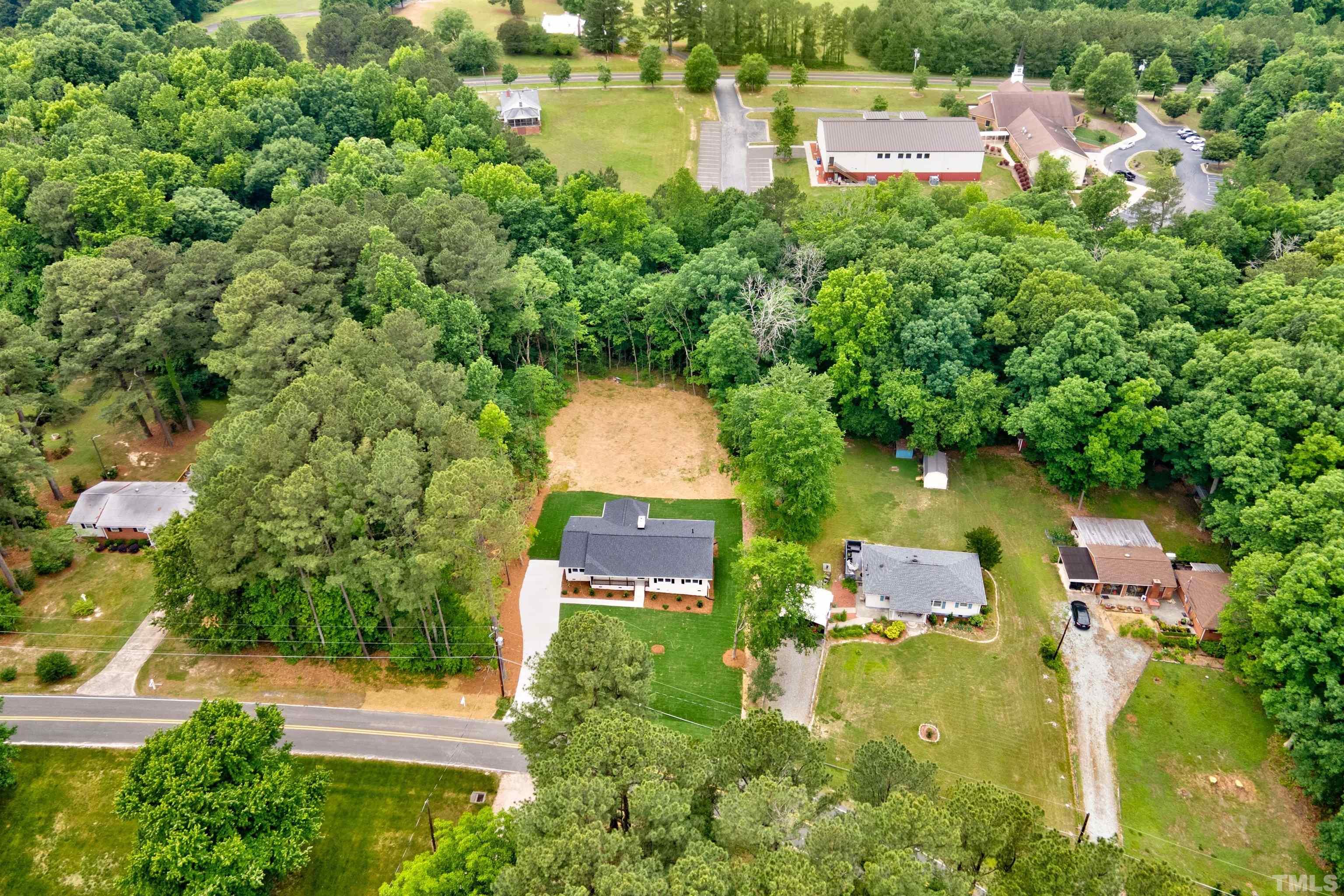 218 Hocutt Road Durham, NC 27703 - Photo 42 of 43 an aerial view of residential house with outdoor space and swimming pool