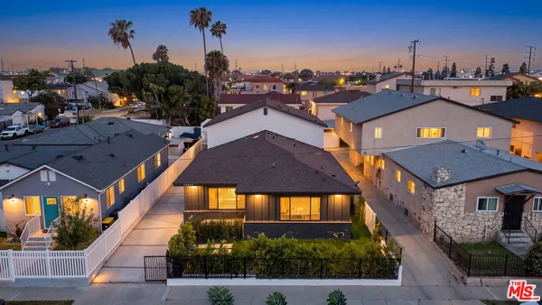 a aerial view of a house with a yard