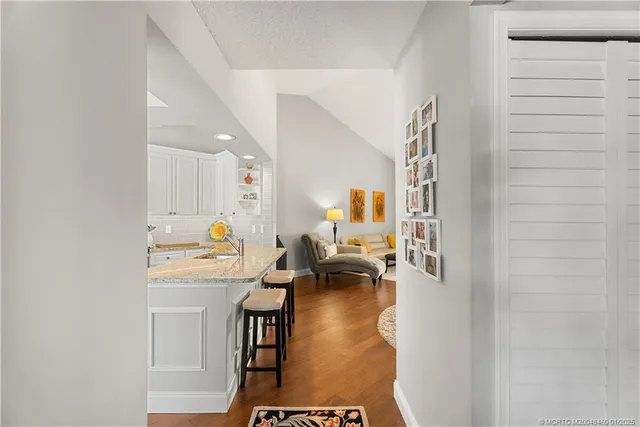 a kitchen with granite countertop sink cabinets and stainless steel appliances