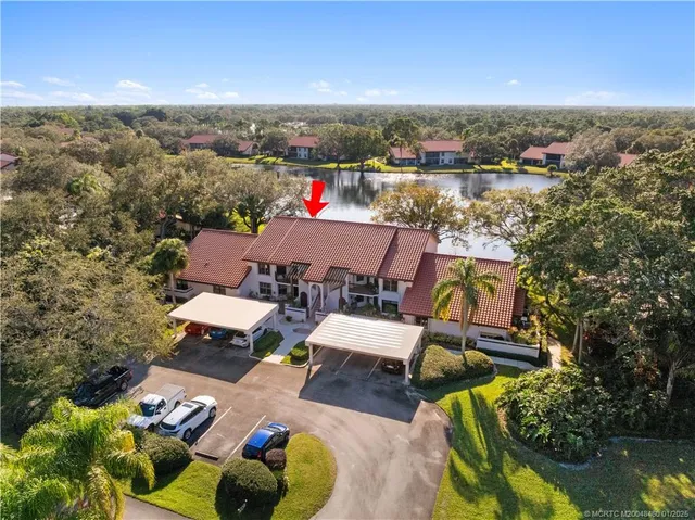 an aerial view of a house with garden space and street view