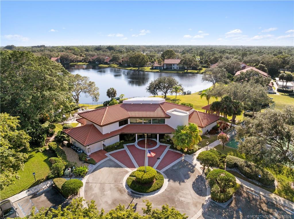6130 Southeast Martinique Drive, Unit 201 Stuart, FL 34997 - Photo 31 of 36 a view of a lake with outdoor space
