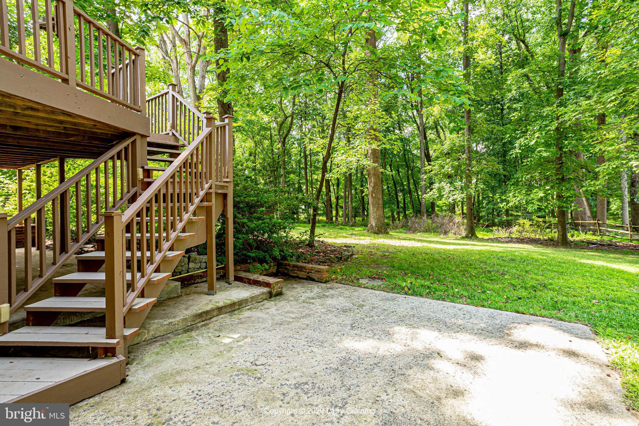 13720 Bridgewater Drive Silver Spring, MD 20904 - Photo 38 of 42 Stairs to deck, from outside basement entrance