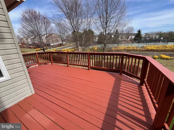 a balcony with wooden floor