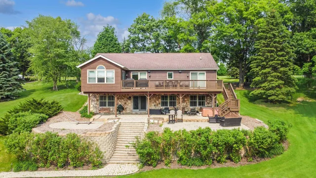 a house view with swimming pool and garden view