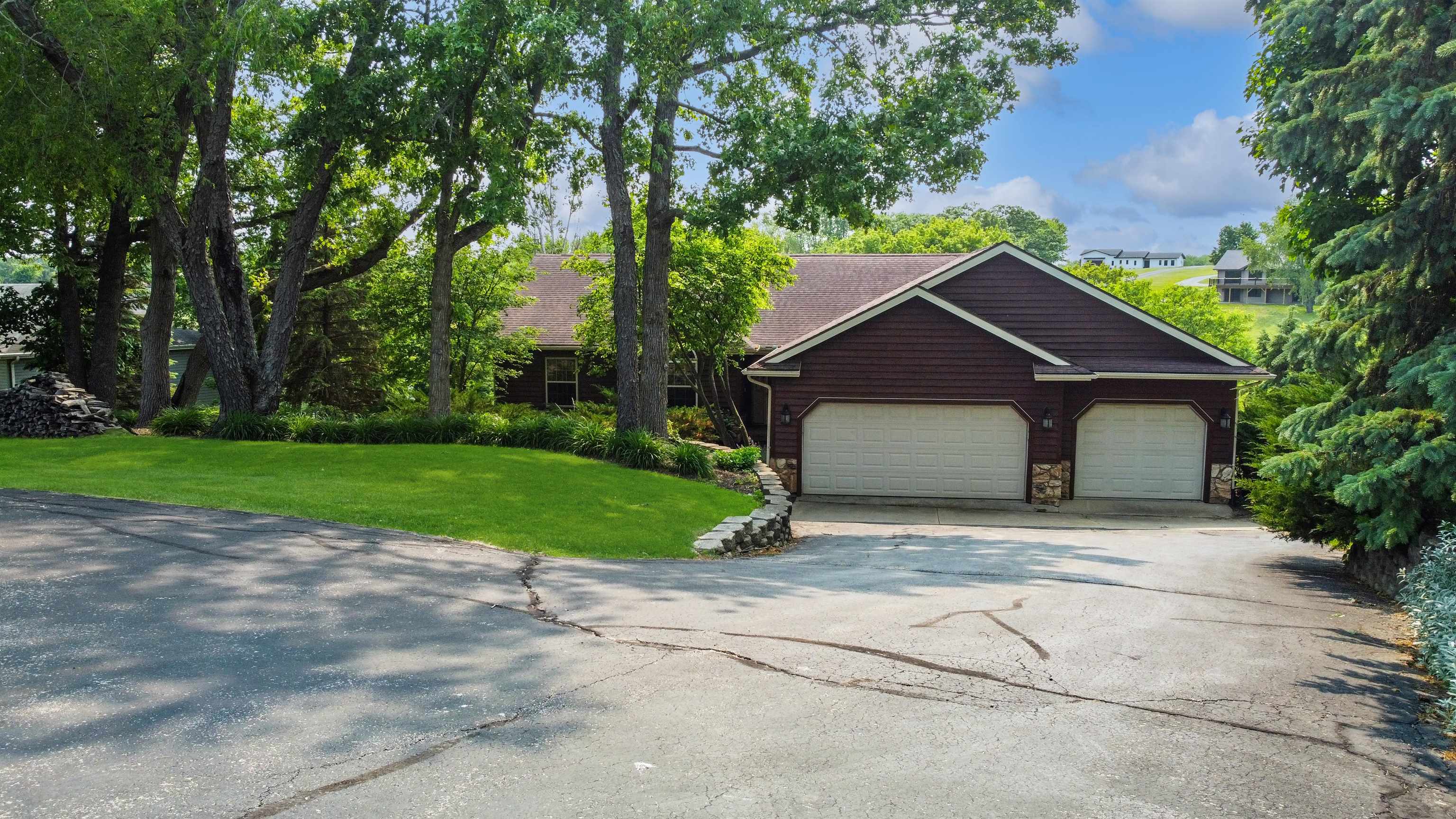 27-54 Ridgeview Drive Lake Carroll, IL 61046 - Photo 2 of 58 a house with green field in front of it