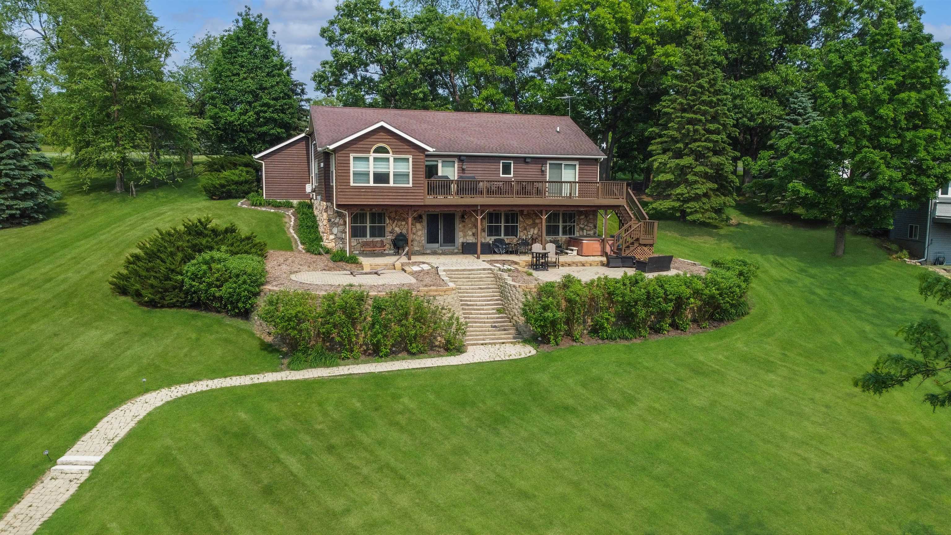 27-54 Ridgeview Drive Lake Carroll, IL 61046 - Photo 39 of 58 a aerial view of a house with a big yard and large trees