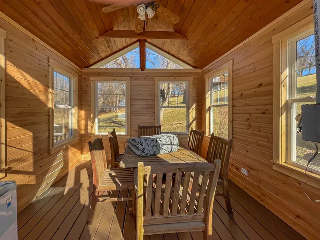 a view of a house with yard and sitting area
