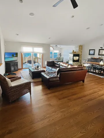 a living room with furniture and a potted plant