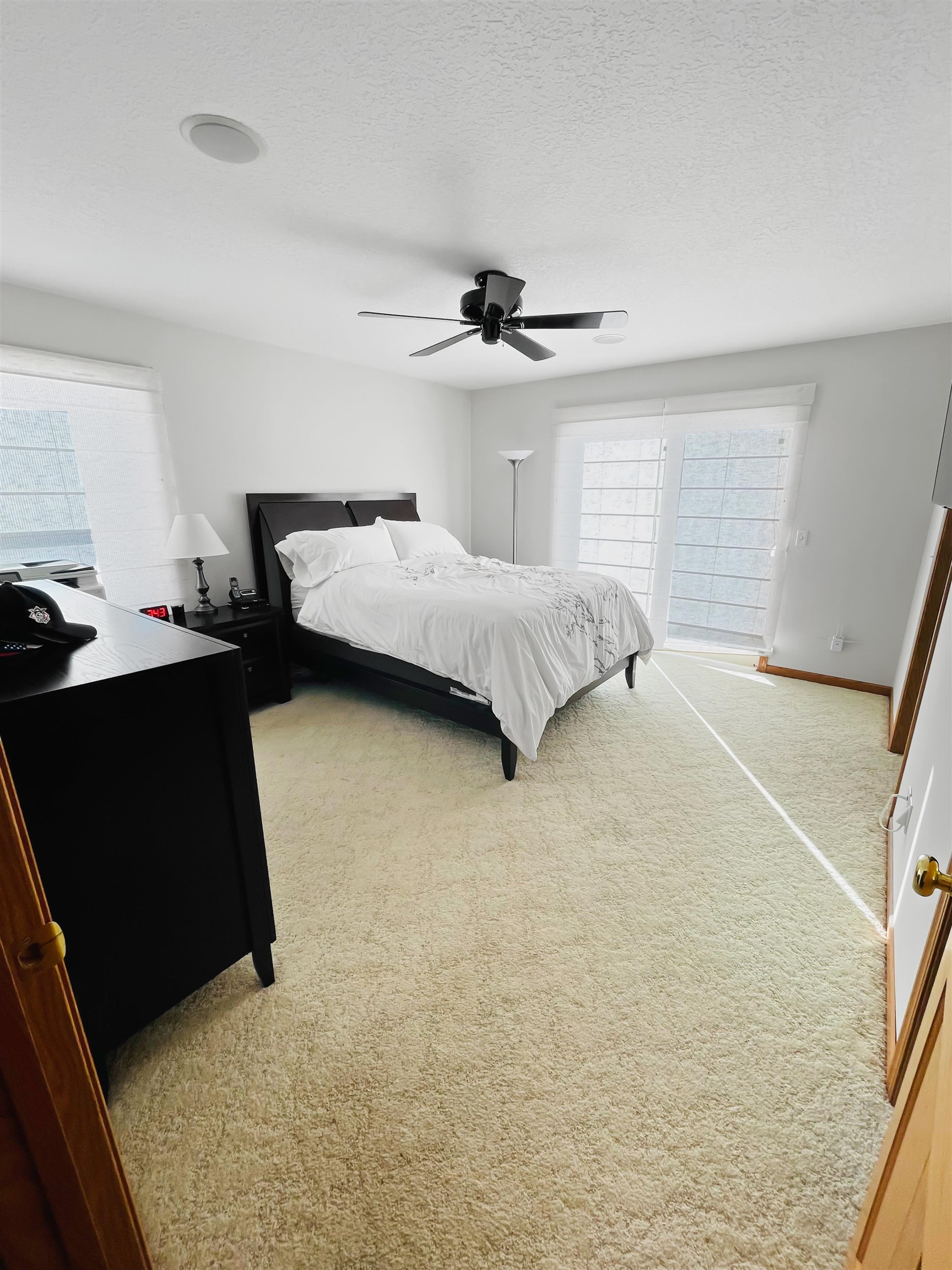 27-54 Ridgeview Drive Lake Carroll, IL 61046 - Photo 9 of 58 a bedroom with a bed and a ceiling fan