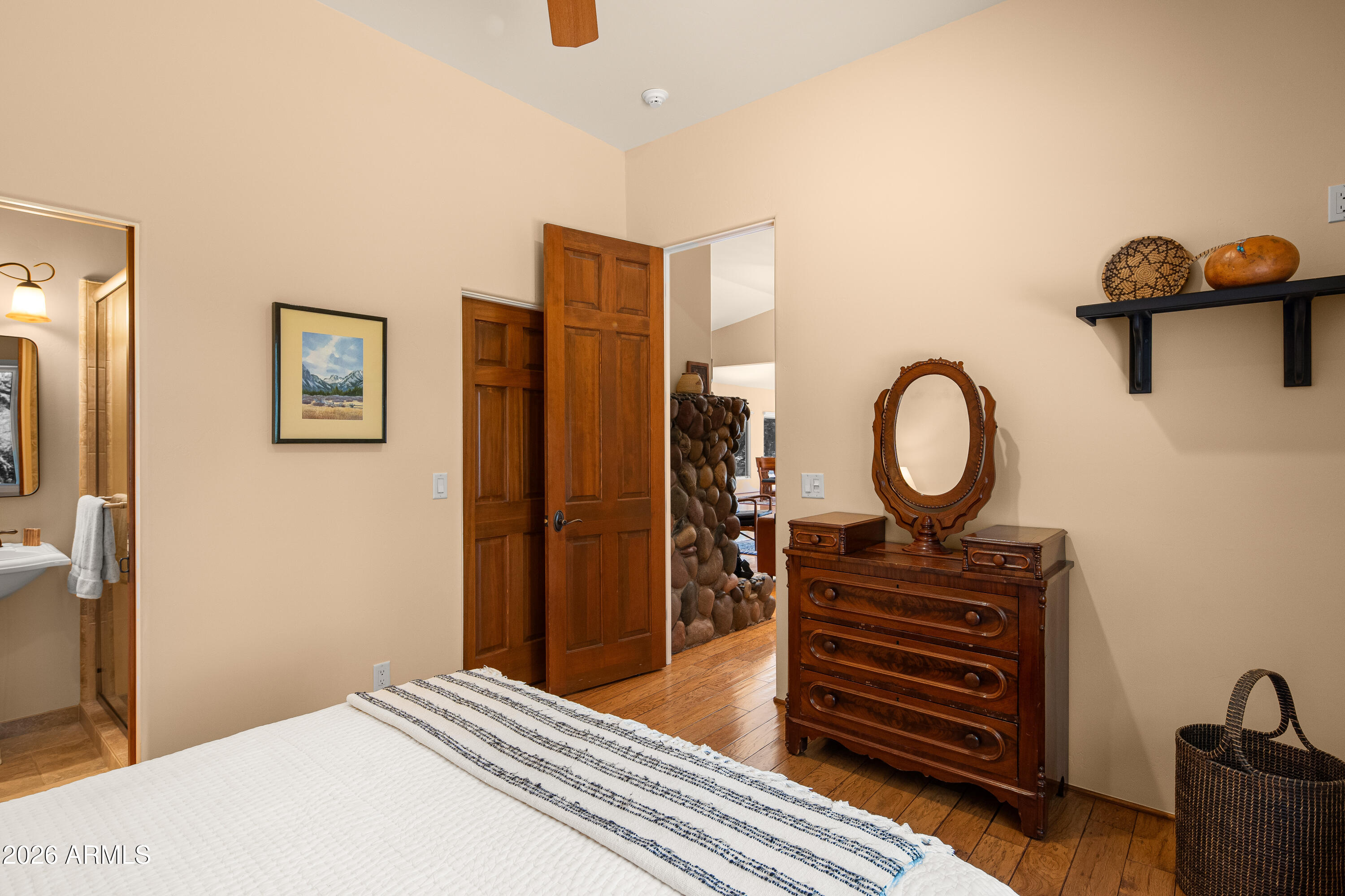 190 Morgan Road Sedona, AZ 86336 - Photo 48 of 51 a bedroom with a bed and a chandelier