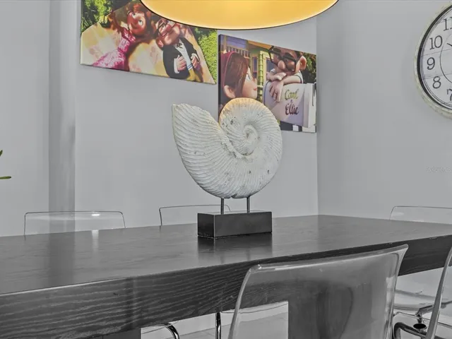 a metallic refrigerator freezer sitting in a kitchen