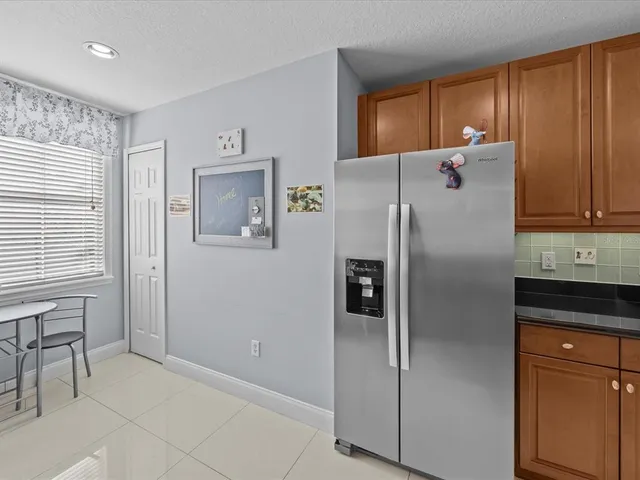 a view of a dining room with a table and chairs