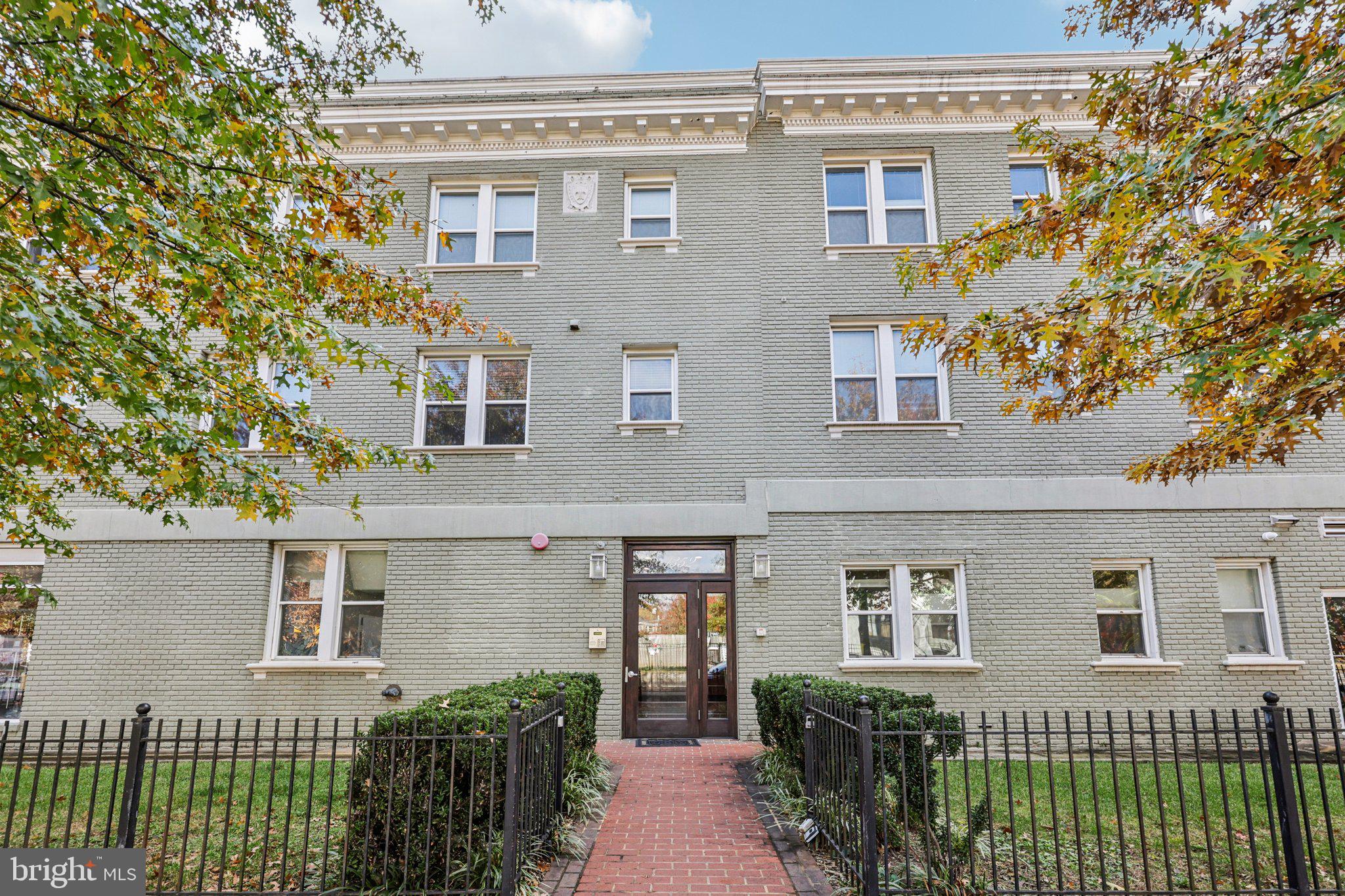 1352 Longfellow Street Northwest, Unit 302 Washington, DC 20011 - Photo 1 of 24 a view of a brick house with large windows