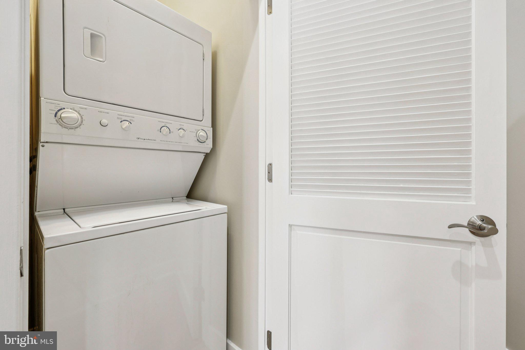 1352 Longfellow Street Northwest, Unit 302 Washington, DC 20011 - Photo 12 of 24 a close up view of a washer and dryer
