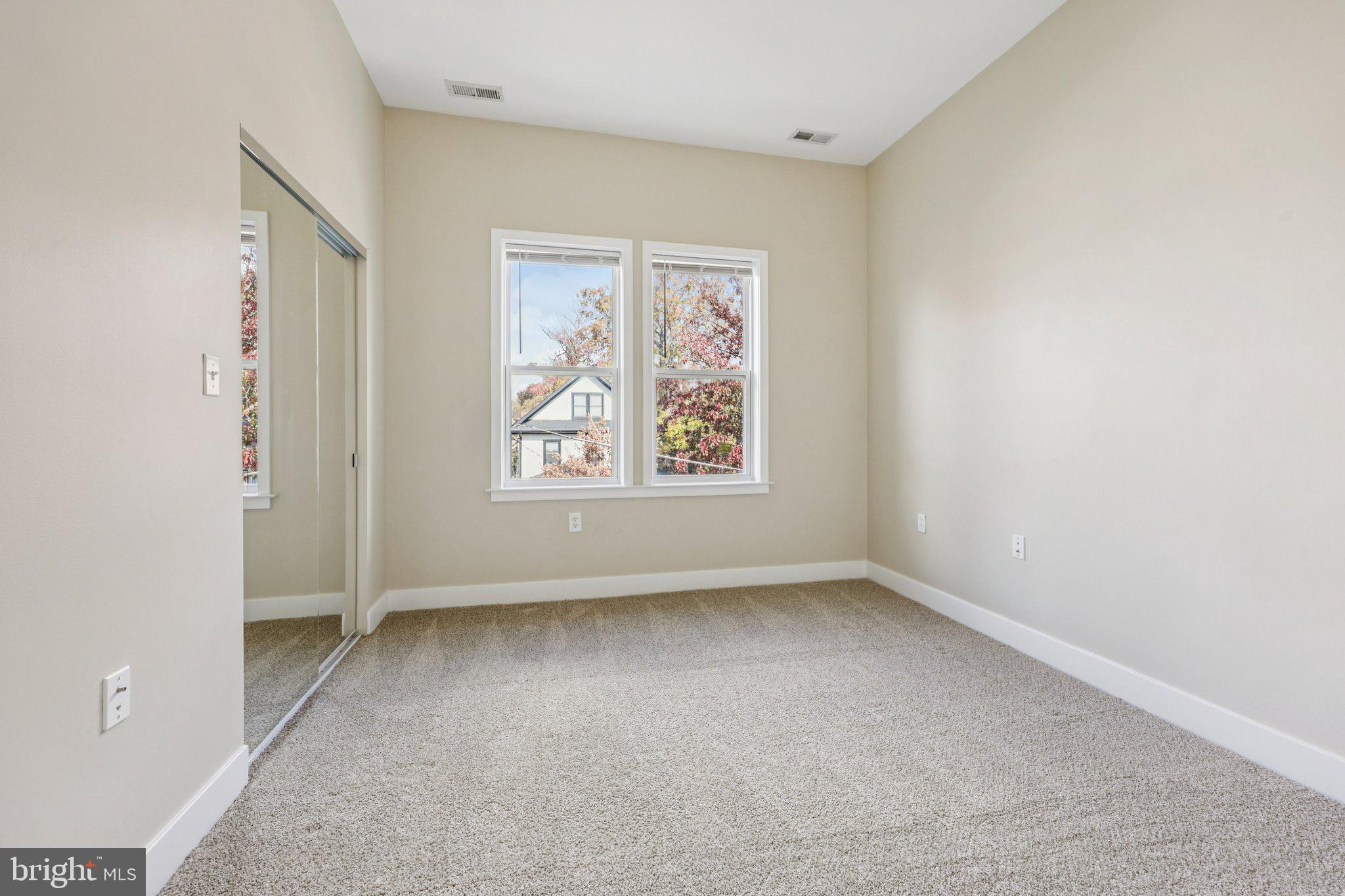 1352 Longfellow Street Northwest, Unit 302 Washington, DC 20011 - Photo 18 of 24 an empty room with windows