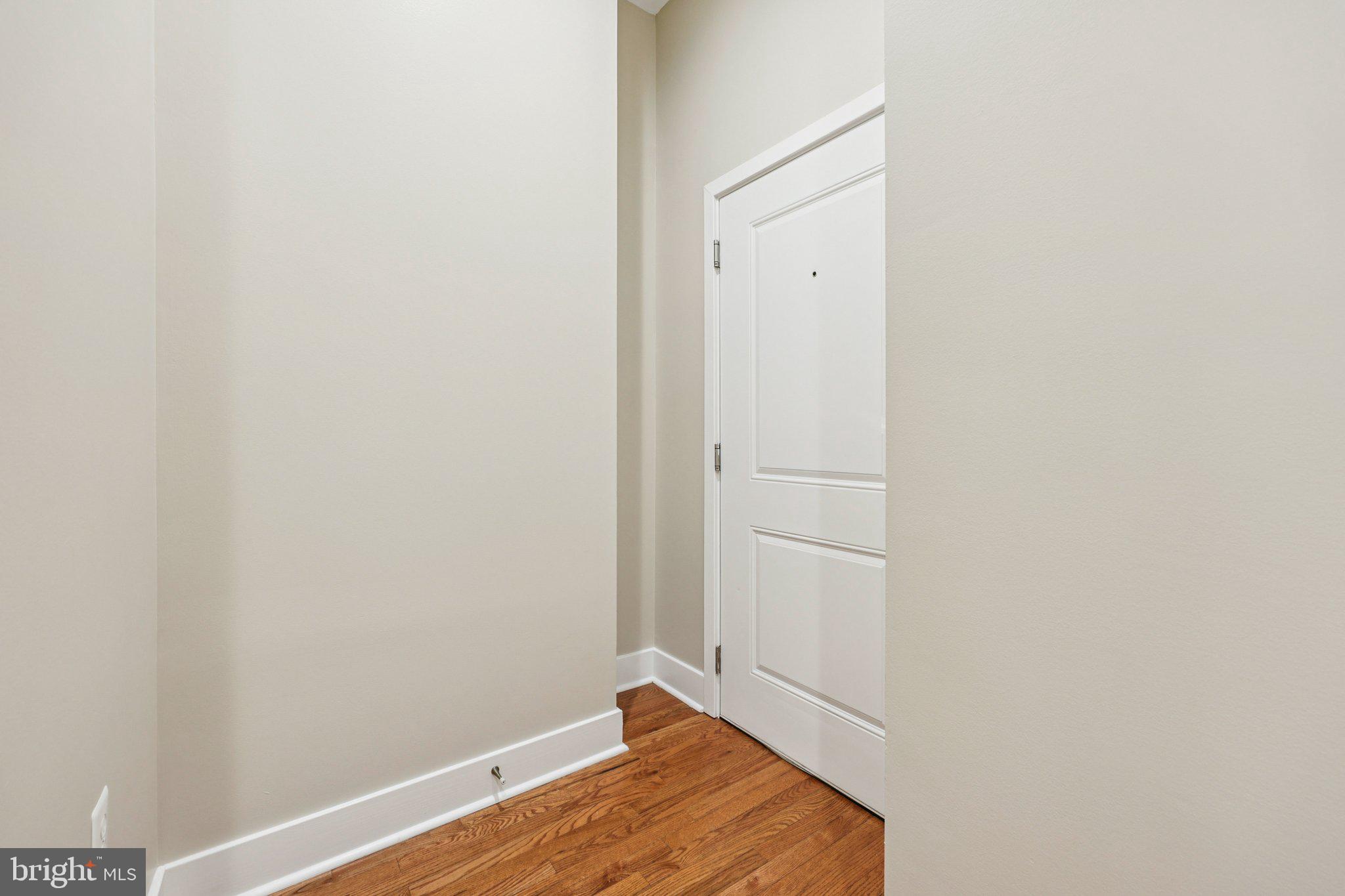 1352 Longfellow Street Northwest, Unit 302 Washington, DC 20011 - Photo 5 of 24 a view of room with wooden floor