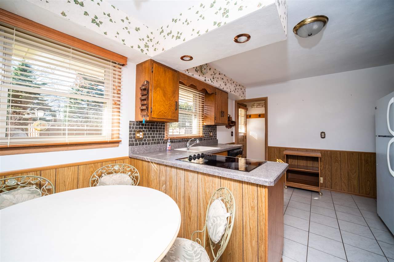 4228 Pinecrest Road Rockford, IL 61107 - Photo 12 of 30 a kitchen with stainless steel appliances a stove a sink and a refrigerator